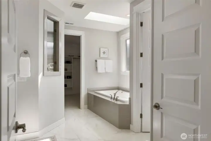 Unwind beneath the natural light of a skylight in your soaking tub, a quiet, spa-like escape designed for slowing down and recharging.