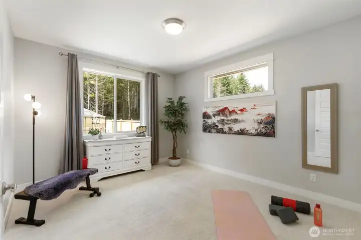 Spacious third bedroom with abundant natural light and flexible use, ideal as a guest room, fitness space, or hobby retreat to suit your lifestyle.