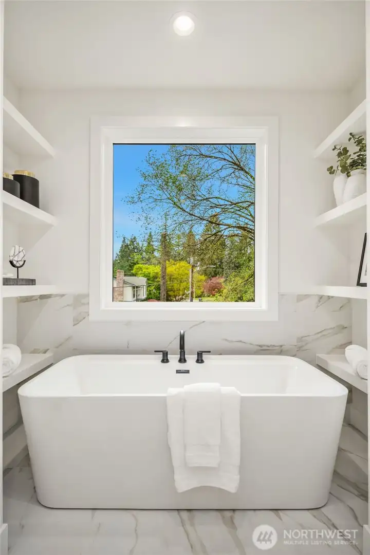 Designer primary suite with five-piece bath & heated floors