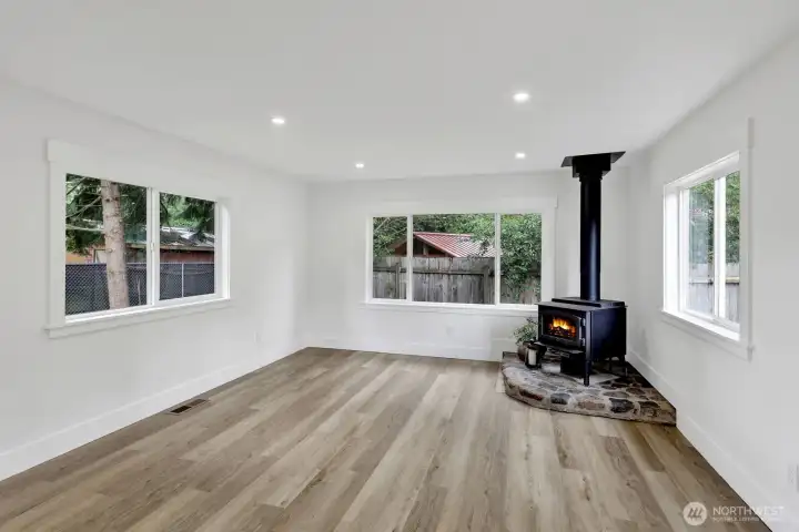 Imagine curling up with a good book or gathering with loved ones beside the efficient wood stove in this warm and welcoming living room, where comfort meets everyday living. Imagine curling up with a good book or gathering with loved ones beside the efficient wood stove in this warm and welcoming living room, where comfort meets everyday living.