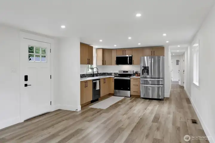 Features new laminate flooring, tile, updated kitchen and baths, and modern finishes throughout. Features new laminate flooring, tile, updated kitchen and baths, and modern finishes throughout.