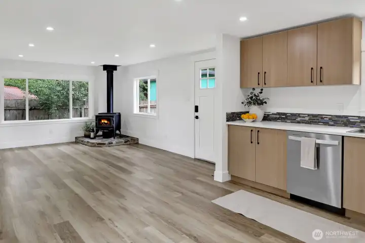 Bright, inviting living room featuring an efficient wood stove for warmth, comfort, and cozy gatherings. Bright, inviting living room featuring an efficient wood stove for warmth, comfort, and cozy gatherings.