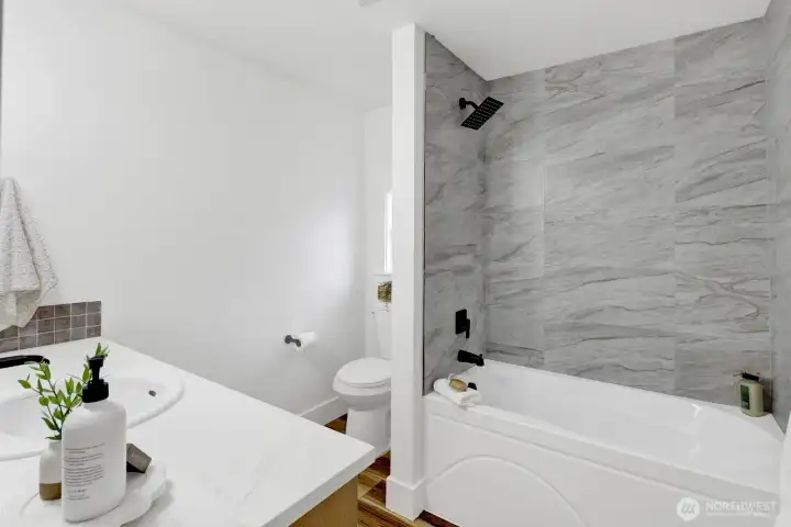 Fresh, bright, and beautifully remodeled, this main, full bathroom showcases all-new fixtures, cabinetry, vanity, sink, and tub, creating a clean and relaxing space to start and end your day. Fresh, bright, and beautifully remodeled, this main, full bathroom showcases all-new fixtures, cabinetry, vanity, sink, and tub, creating a clean and relaxing space to start and end your day.