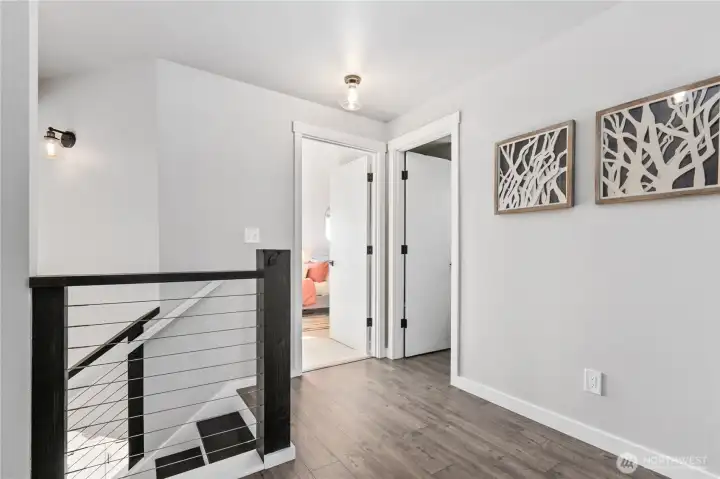 Wide upper hallway creates separation of space while maintaining an open and connected feel throughout the home. Wide upper hallway creates separation of space while maintaining an open and connected feel throughout the home.