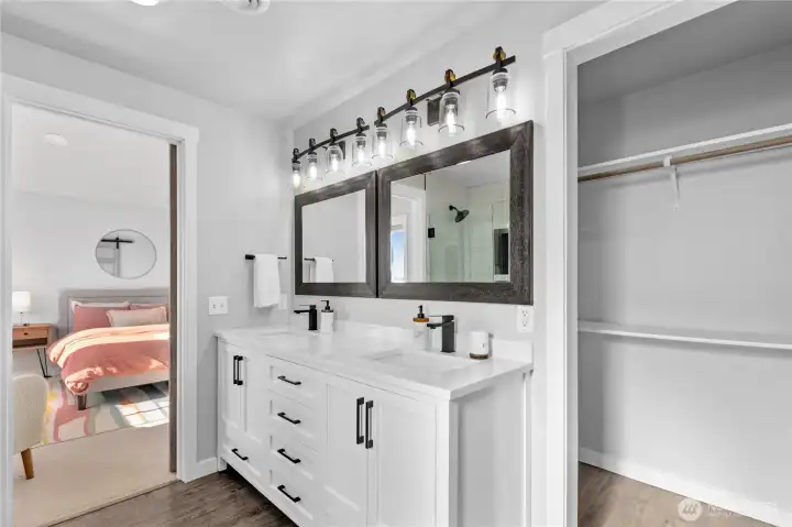 Designer ensuite bath combines clean modern lines, abundant storage, and a spacious walk-in closet for everyday convenience. Designer ensuite bath combines clean modern lines, abundant storage, and a spacious walk-in closet for everyday convenience.