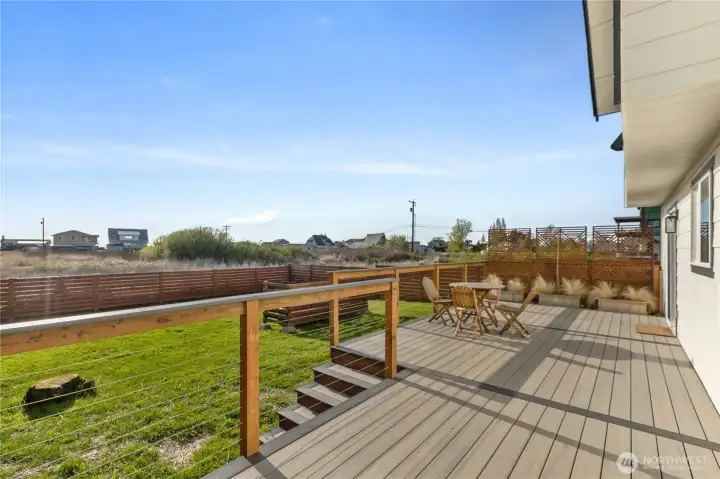 Expansive composite deck creates an ideal setting for outdoor dining, entertaining, or enjoying sunny afternoons overlooking the fully fenced yard. Expansive composite deck creates an ideal setting for outdoor dining, entertaining, or enjoying sunny afternoons overlooking the fully fenced yard.