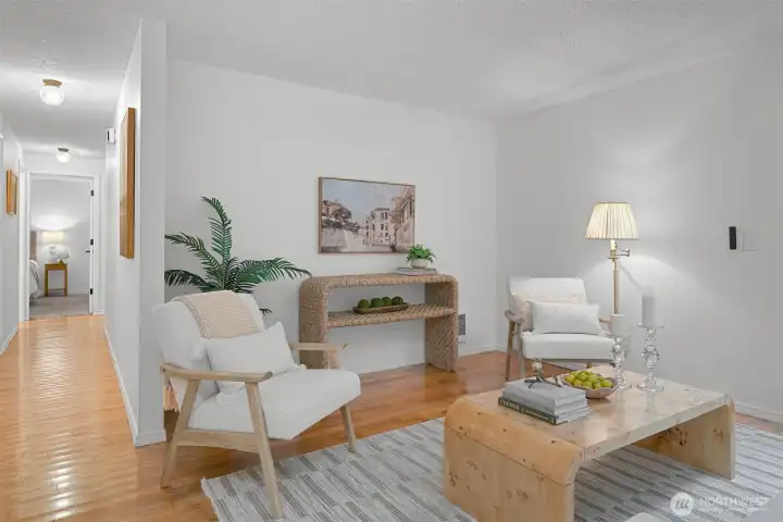 Living room features generous wall space, warm flooring, and room for multiple furniture layouts.