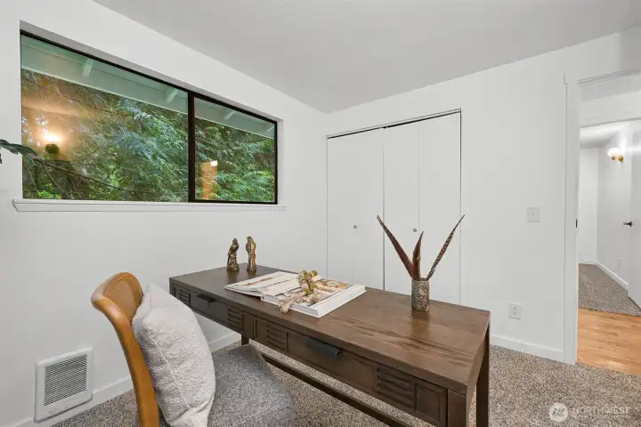 Additional room offers versatility for remote work, creative space, or everyday living needs.