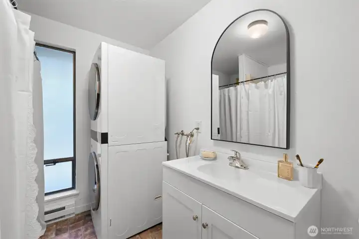 Updated vanity and laundry provide practical convenience for everyday living.