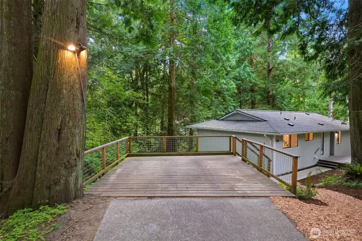 Elevated deck for parking or additional entertaining space.
