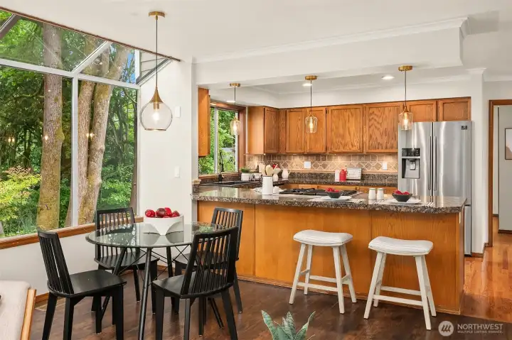 Lovely Attrium Window in the Breakfast Nook Allows Nature and Natural Light to flow