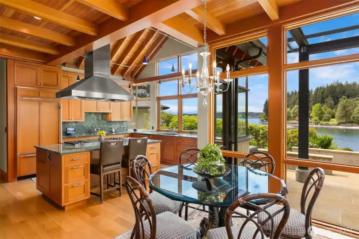 Constantly shifting shape and form, floor-to-ceiling windows, steel, wood, all complimented by extraordinary surroundings. View from kitchen dining to a truly remarkable kitchen.