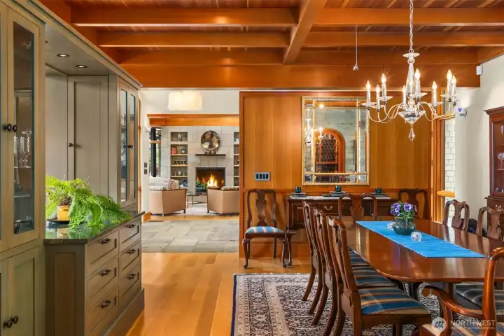 View across the dining room to the living room. Note the mirror reflecting the wine cellar behind the camera.
