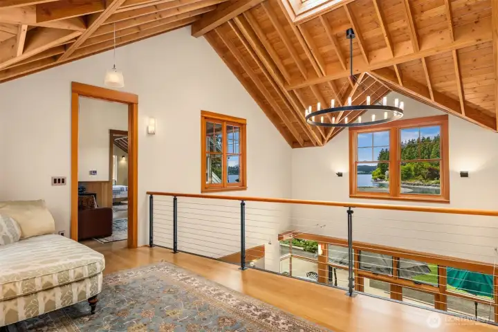 The perch, bridging the east and west wings of the second floor. Skylights invite the sky and floating windows frame the moving picture of Bainbridge Island's natural beauty!