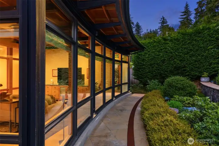 The gentle curvature of the 110' feet of pristine shoreline introduced with the front homes's dramatic, moving curvature.