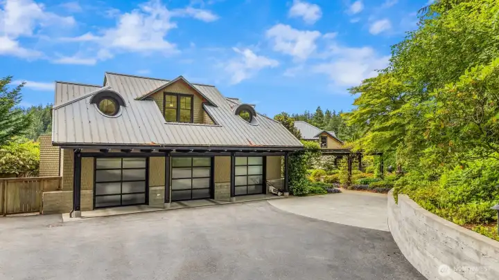 The 1,297 square foot, finished, heated 3 car garage. The home sits on a .7+ acre, private site.