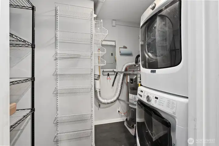 Barn door leads to the laundry/utility room with storage racks