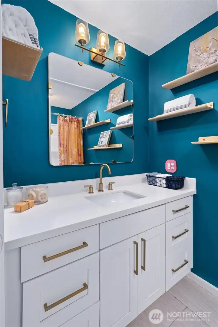 Main bath with designer paint and gold accents