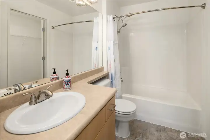 Primary Bathroom with shower over the tub