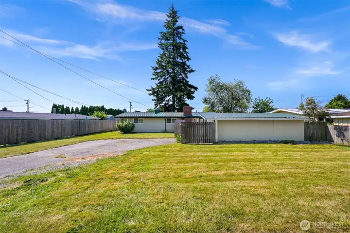 View of home, front lawn and garage