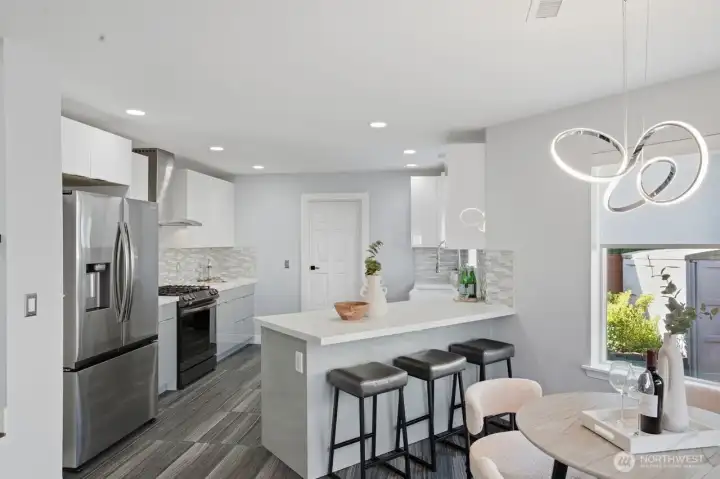 At the heart of the home is the beautifully remodeled kitchen, blending functionality with modern upscale appeal. It showcases rich quartz countertops, high-end soft close cabinetry, gas range, stainless steel appliances, walk-in pantry, and a sunlit breakfast nook. At the heart of the home is the beautifully remodeled kitchen, blending functionality with modern upscale appeal. It showcases rich quartz countertops, high-end soft close cabinetry, gas range, stainless steel appliances, walk-in pantry, and a sunlit breakfast nook.