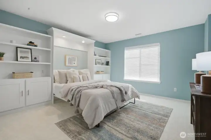 A guest bedroom w/ a built-in Murphy bed provides flexibility for guests, hobbies, or home office set up. A guest bedroom w/ a built-in Murphy bed provides flexibility for guests, hobbies, or home office set up.