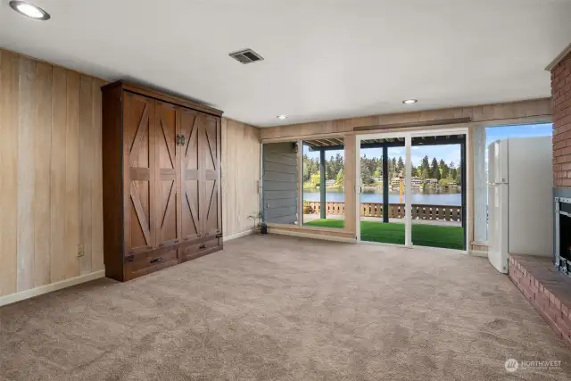 Lower Level Family Room with Murphy Bed makes for a great 4th Bedroom.