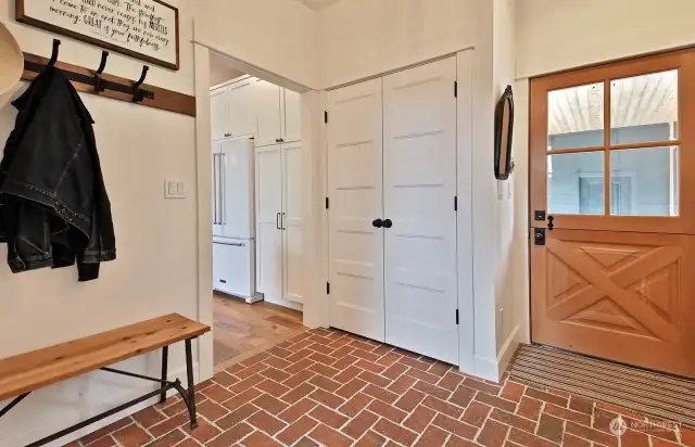 This is the entry way from the covered walkway that leads to your 3 car garage. The laundry room, office (can also be another guest room) and 3/4 main level bath are to your back, laundry room is to your right and a generous closet straight ahead.