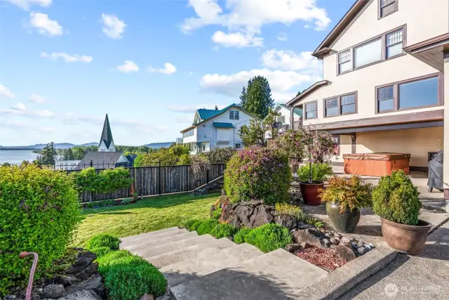 Partially fenced yard takes in the views of the town and the river