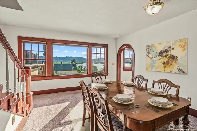 Step down to formal living room with windows to capture the light and views