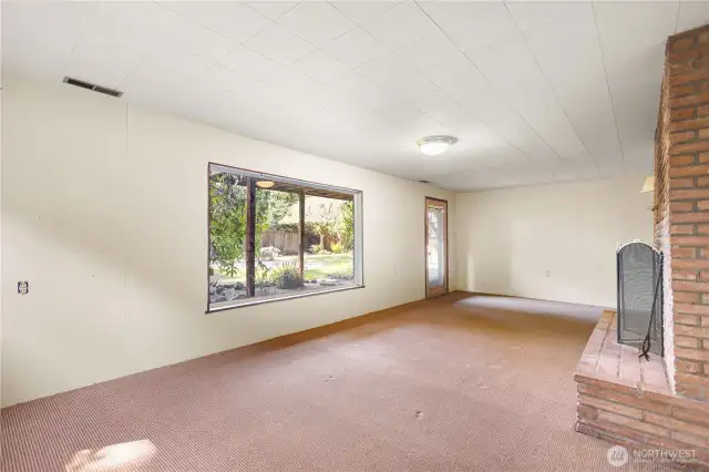 Spacious rec room with fireplace on lower level