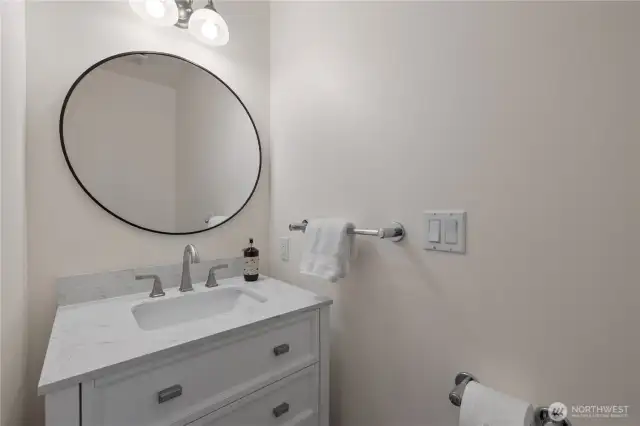 1/2 bath next to bedroom off entry way
