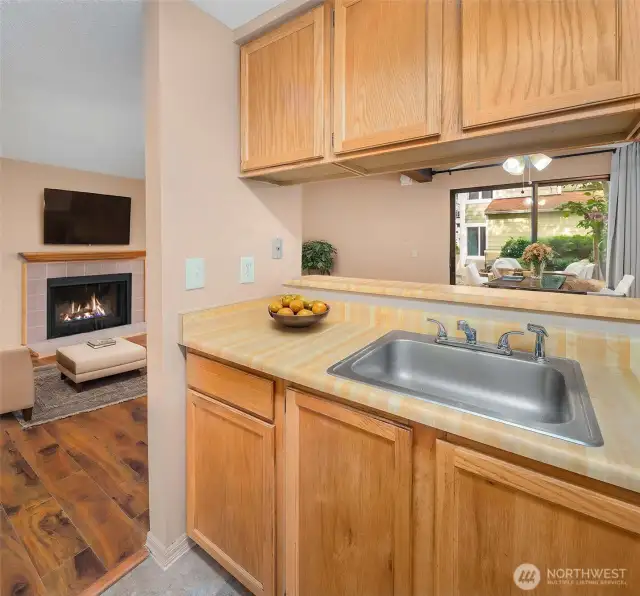 Alternate view of the kitchen showcasing additional cabinetry and workspace. Thoughtfully designed for maximum functionality with a clean and organized feel, perfect for home chefs.