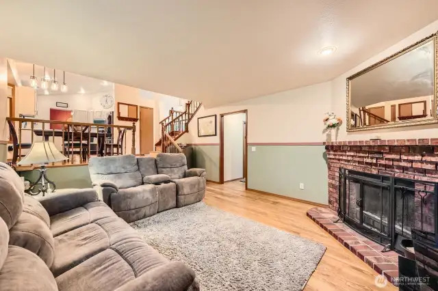 RELAXING SUNKEN FAMILY ROOM PROVIDES THE IDEAL SPACE FOR LEISURE AND RECREATION.