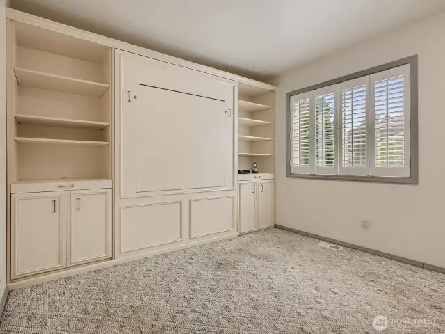 SPACIOUS FORTH BEDROOM ON MAIN FLOOR WITH MURPHY BED AND FOLD DOWN DESK.
