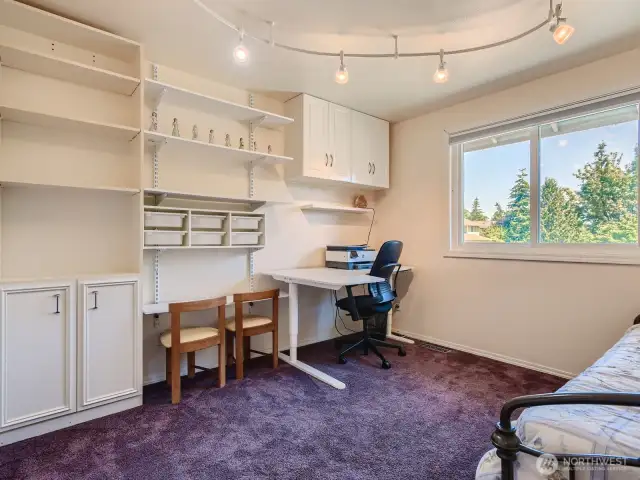 COMFORTABLE SECOND BEDROOM UPSTAIRS IS ATTRACTIVE AND BRIGHT. PERFECT FOR OFFICE OR CRAFTS.