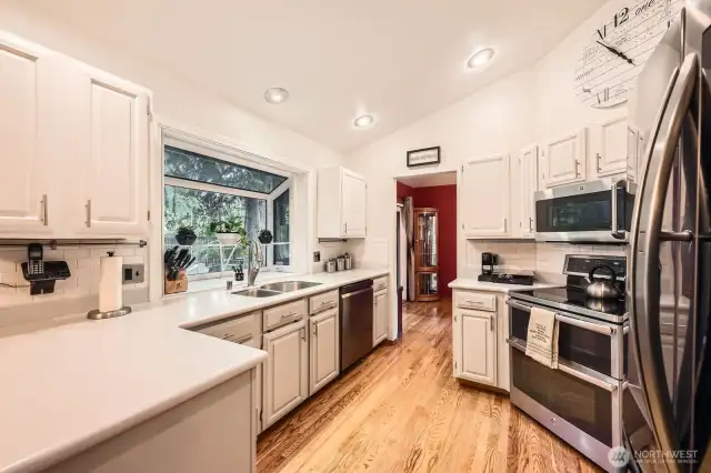 LARGE KITCHEN WITH ABUNDANT CABINET AND COUNTER SPACE, BAY WINDOW, ALL S-STEEL APPLIANCES COME WITH THE HOME!