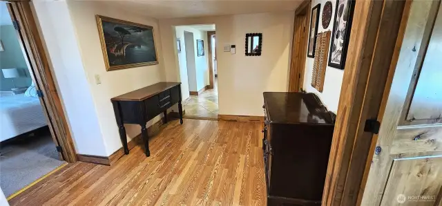 Heading out of the main bedroom to the hall then to the second bedroom.