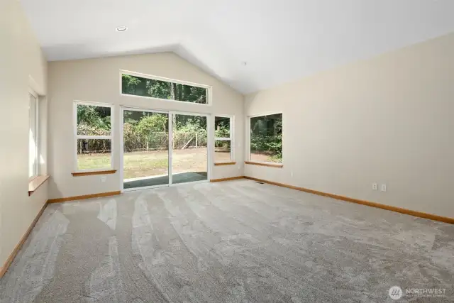 Beautiful primary suite with slider to back patio.