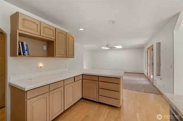 Open kitchen with so much counter space and hall pantry