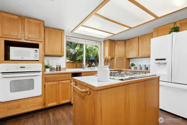 Solid oak cabinets could be nicely updated with paint, re-staining and contemporary hardware.