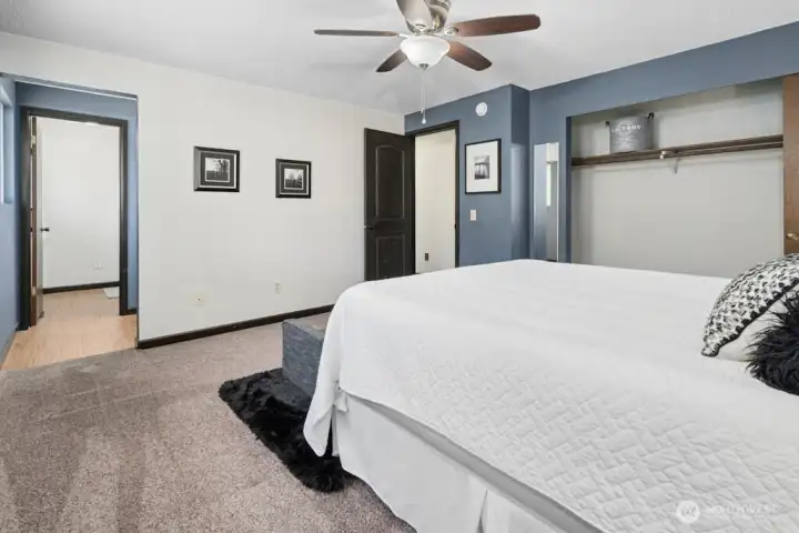 Ensuite primary bath with separation between vanity and the shower/toilet area.