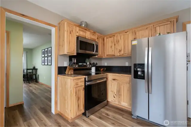 Updated kitchen featuring stainless appliances and granite countertops