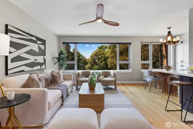 Large SW windows bringing in an abundance of natural light. Look out over Kinnear park + Elliot Bay water views in the winter!
