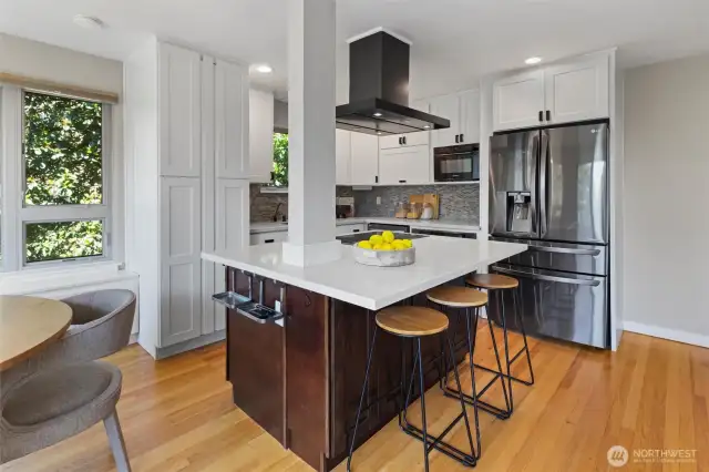 Island with bar seating + induction stove top.