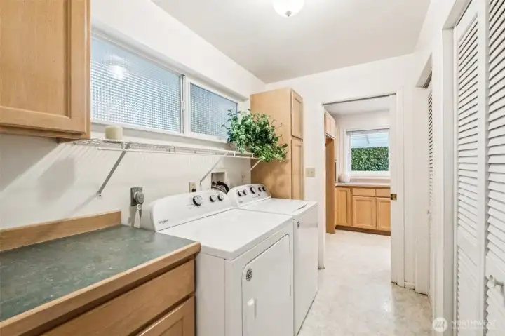 Laundry room can be closed off by pocket doors on both ends