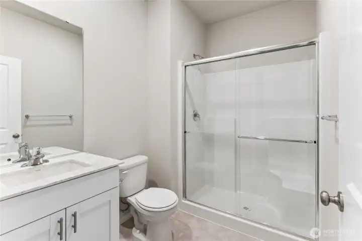 spacious, light and bright bathroom on the main level!