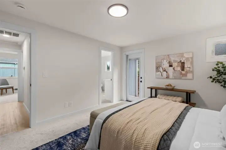 The primary also includes a door leading out to the deck.