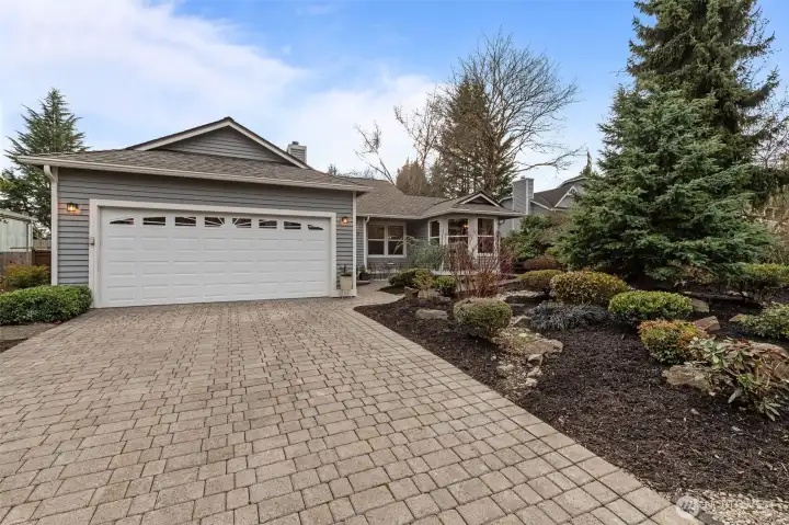 The attached 2-car garage offers ample space for both parking and storage, and the driveway gives you room for even more cars or easy guest parking.