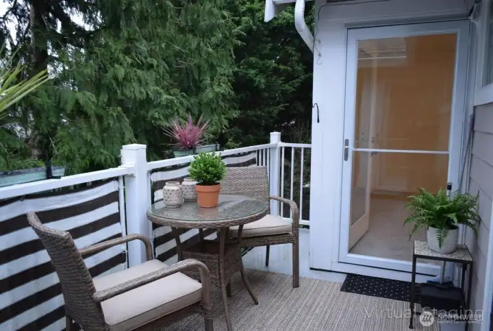 Private patio opens to primary bedroom and dining room. Equipped with locking storm doors